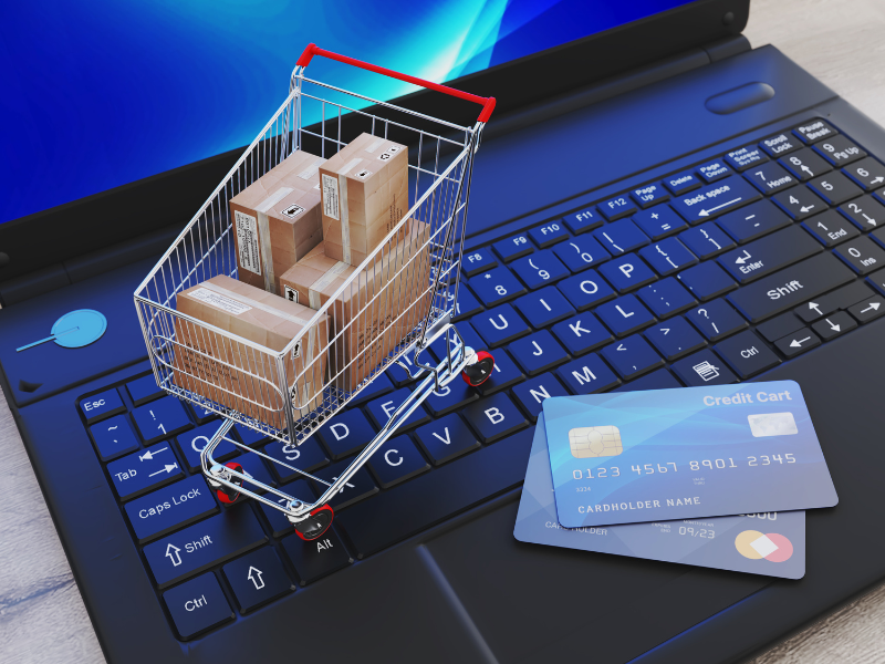 E-commerce website on a laptop screen with a shopping cart icon